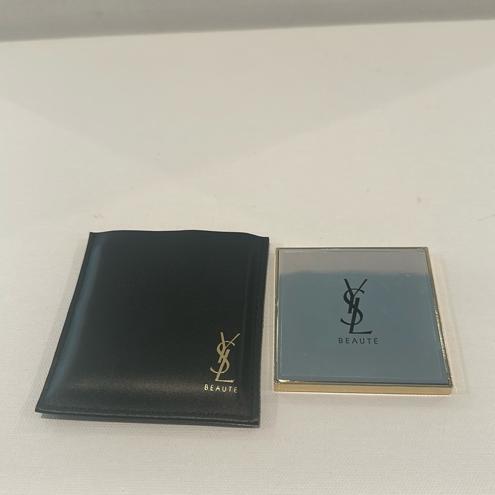 YSL Beauty Goldtone Cosmetic Mirror in Case. This mirror has never been used.